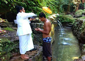 cleansing with holy water, suwut waterfall, gianyar places of interest